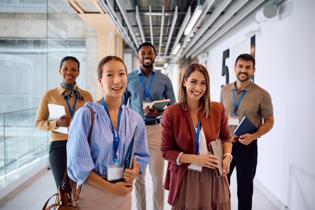 Careers - CAREER PROGRAMME AND POLICY 1 happy diverse coworkers in hallway of an corporate 2026 01 09 11 57 03 utc Medium