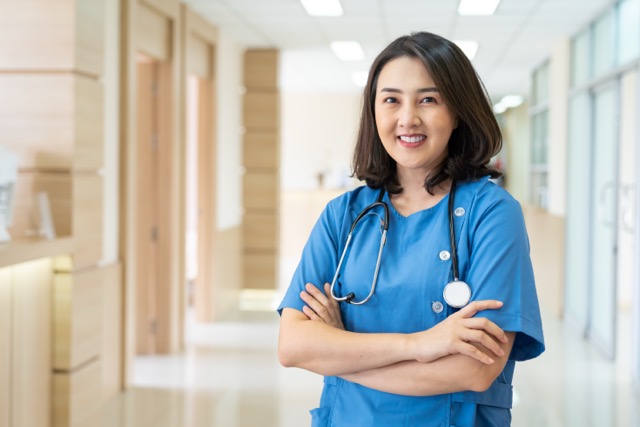portrait of asian smiling female nurse in hospital 2026 03 26 08 15 51 utc Medium