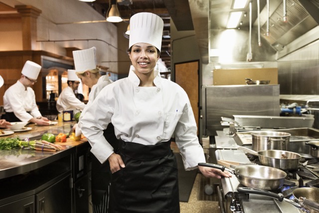 smiling chef prepares food in commercial kitchen 2026 03 25 05 27 14 utc Medium